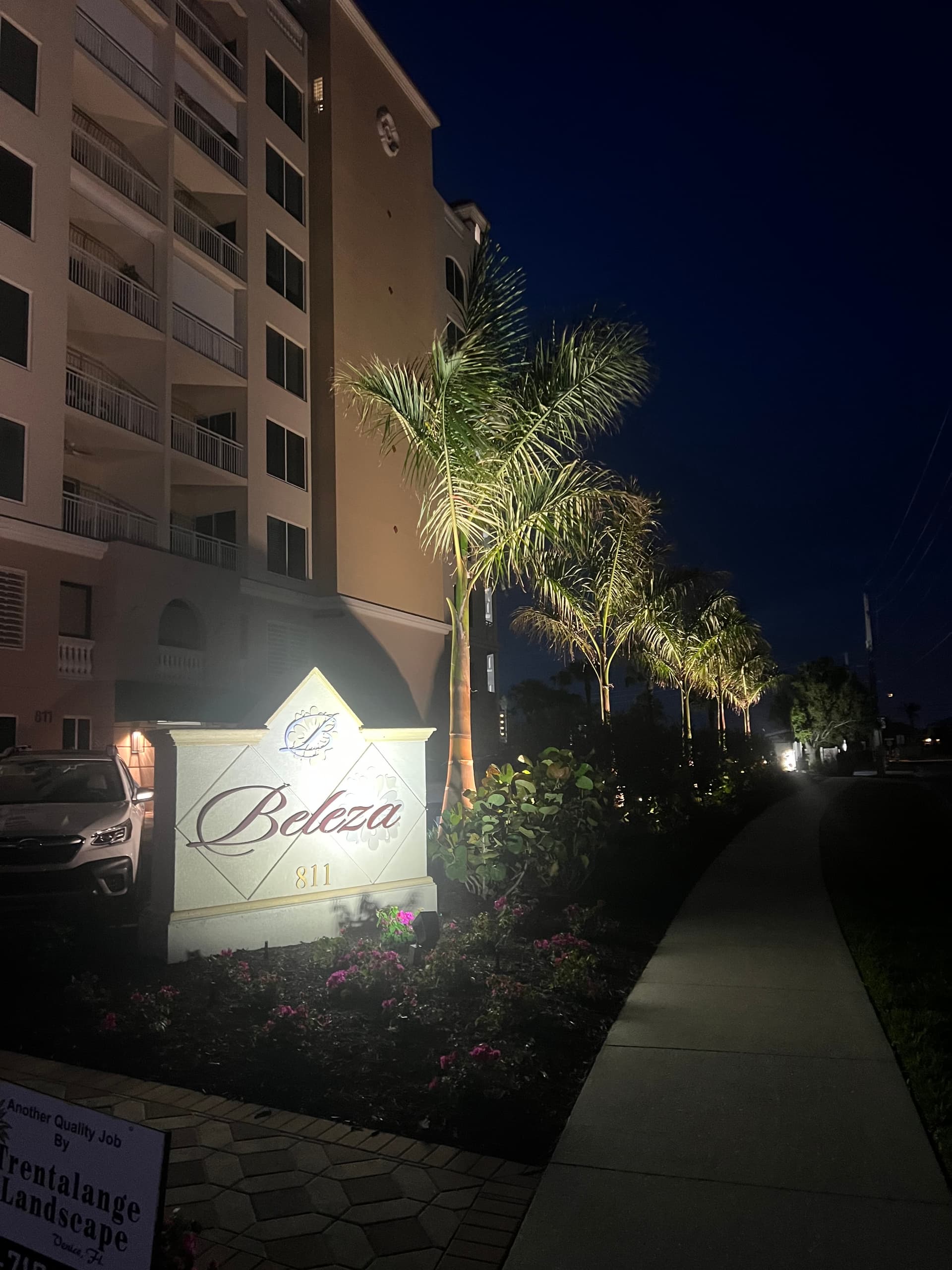 Commercial landscape lighting at Beleza condo entrance